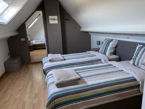 Postel nebo postele na pokoji v ubytování Vakantiewoning Leberg