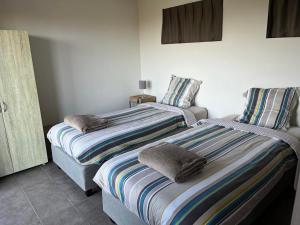 Postel nebo postele na pokoji v ubytování Vakantiewoning Leberg
