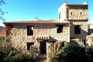 a stone building with a tower on top of it at La maison Madeleine in Nyons