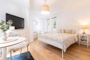 Giường trong phòng chung tại Vikaro Zimmer