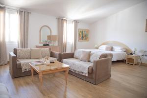Postel nebo postele na pokoji v ubytování Hotel la Caravelle