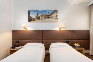 Postel nebo postele na pokoji v ubytování Hotel Minerva + 37 fotografií
