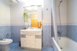 a bathroom with a sink and a toilet and a shower at Casa Joek in Los Alcázares +15 photos