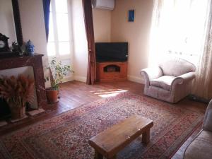 Χώρος καθιστικού στο La appartement des rosiers