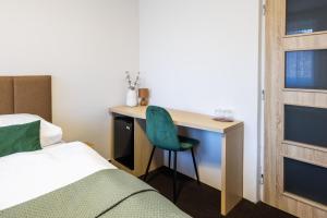 Postel nebo postele na pokoji v ubytování Hotel JISKRA na Čeladné