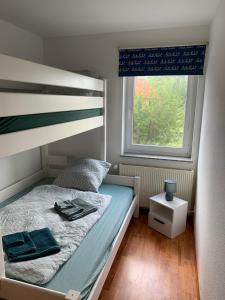 Postel nebo postele na pokoji v ubytování Brüni 18 - Idyllische Wohnung auf dem Land