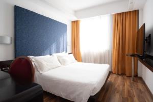 Telewizja i/lub zestaw kina domowego w obiekcie Hotel IMPERATORI