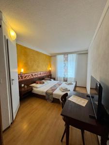Postel nebo postele na pokoji v ubytování Hotel Post Cunter Biancardi + 36 fotografií