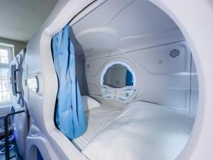 an inside view of an airplane with a bed at Boutique-Capsule Hostel in Warsaw