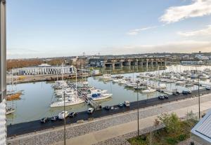 a view of a marina with boats in the water at B&B HOTEL Bordeaux Bassins à flot in Bordeaux