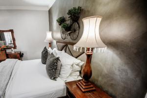 Ένα ή περισσότερα κρεβάτια σε δωμάτιο στο Opikopi Guest House +11 φωτογραφίες