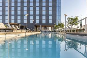a swimming pool in front of a building at Omni Louisville Hotel in Louisville