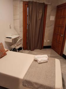 Postel nebo postele na pokoji v ubytování Hotel Océano Centro