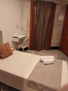 Postel nebo postele na pokoji v ubytování Hotel Océano Centro