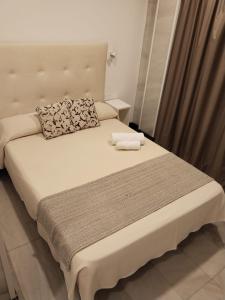 Postel nebo postele na pokoji v ubytování Hotel Océano Centro