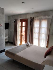 Postel nebo postele na pokoji v ubytování Hotel Océano Centro