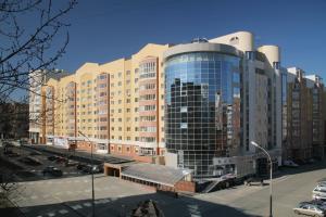 a large building with a lot of windows at Vizavi Hotel in Yekaterinburg