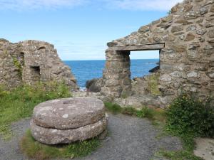 an old stone building with an entrance to the ocean at Carreg Yr Onnen in Haverfordwest