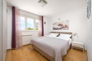 Postel nebo postele na pokoji v ubytování Comfortable Apartment