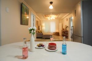 a table with two bottles and two plates of food at The Shim Anam 3rooms late check in-out in Seoul