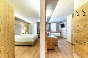 Ένα ή περισσότερα κρεβάτια σε δωμάτιο στο Hotel Crozzon