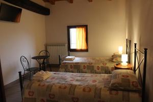 Tempat tidur dalam kamar di La Barchessa Country House