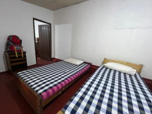 Letto o letti in una camera di Gleeful Hostel