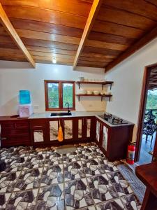 a kitchen with a sink and a counter top at English Cottage House Tagaytay in Calaca