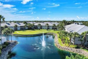 an aerial view of a villa with a swimming pool at Greenlinks Naples Florida Condo in Naples