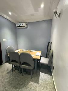 a meeting room with a table and chairs at 1 bedroom Shortlet Apt at Osapa London Lekki in Lagos