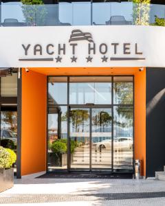 an entrance to a yacht hotel with its doors open at Yacht Hotel in Vlorë