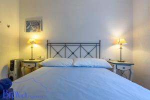 En eller flere senge i et værelse på Casa Llúcia - Check-out 1 pm I 3' playa I planta baja I céntrico I equipado