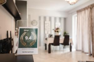 a sign sitting on a table in a living room at Sea View Apartment in Chalkida