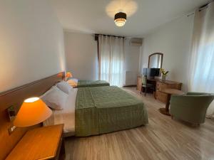 Postel nebo postele na pokoji v ubytování Hotel Clementi