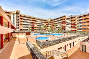 an apartment complex with two pools and a resort at Santos Lerch Sol Apartment in Puerto de Santiago