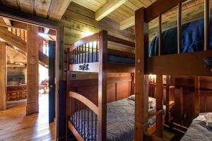 a bedroom with two bunk beds in a cabin at Mt Baker Rim Cabin 44 - A Cozy Rustic Cabin With Modern Charm in Glacier