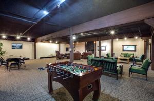 a room with a foosball table in the middle at Snowline Lodge - Condo 37 - A very cute condo - near the mountain, now has Wifi in Deming