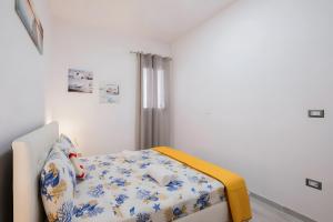 Ένα ή περισσότερα κρεβάτια σε δωμάτιο στο Il Nido sul Mare Sea View