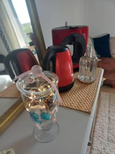 a glass bowl with christmas lights on a table at L'Essentiel in Oherville +39 photos