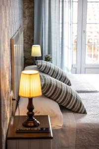 Ein Bett oder Betten in einem Zimmer der Unterkunft Hotel Puerto Arnela