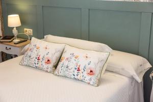 Ein Bett oder Betten in einem Zimmer der Unterkunft Hotel Puerto Arnela