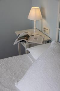 Ein Bett oder Betten in einem Zimmer der Unterkunft Hotel Puerto Arnela