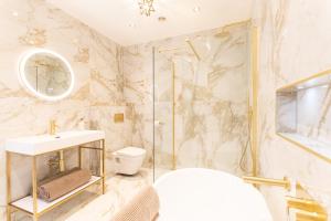 a bathroom with a shower and a sink and a toilet at Northern Hideaways Oakfield Lodge, Ponteland in Newcastle upon Tyne