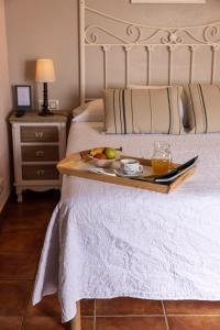 Ein Bett oder Betten in einem Zimmer der Unterkunft Hotel Puerto Arnela
