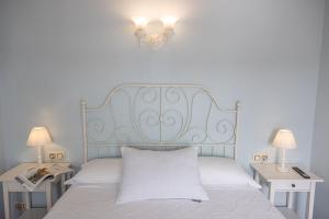 Ein Bett oder Betten in einem Zimmer der Unterkunft Hotel Puerto Arnela