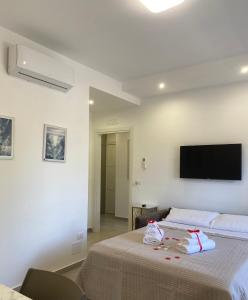 TV a/nebo společenská místnost v ubytování SANGIOVANNI apartaments