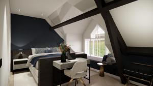 a bedroom with a bed with a desk and a chair at Hotel - restaurant Hoeve Kromwijk in Zoetermeer