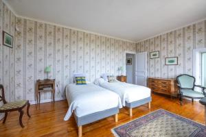 Ένα ή περισσότερα κρεβάτια σε δωμάτιο στο Le Cottage de Marguerite