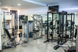 a gym with a bunch of tread machines in it at Servatur Casablanca Suites & Spa - Adults Only in Puerto Rico de Gran Canaria