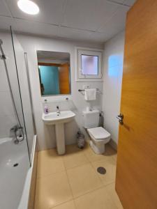a bathroom with a sink and a toilet at Mar Menor Golf Resort, Fitnes, Tennis, wellness, Security! in Torre-Pacheco